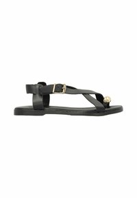 Black sandals with a flat sole, featuring crisscross straps, a gold accent ball, and a buckle closure. Made of synthetic materials.