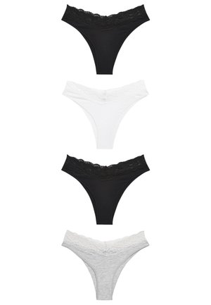 String en coton blanc avec une taille en dentelle. La dentelle présente un motif floral. Le tissu semble doux avec une texture lisse.