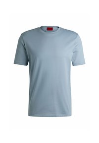 T-shirt a maniche corte blu chiaro in un morbido misto cotone, con colletto rotondo e dettagli di cucitura minimali. Etichetta visibile sul colletto.