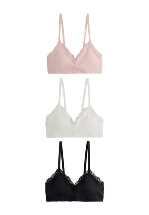 Drei spitzenverzierte Bralettes mit dünnen Trägern in Pink, Weiß und Schwarz, vertikal auf einem schlichten weißen Hintergrund angeordnet.