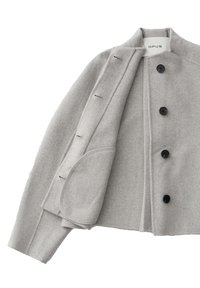 Light grey wool coat with black buttons, open to show inner flap with buttonholes, and label reading Opus inside the collar.