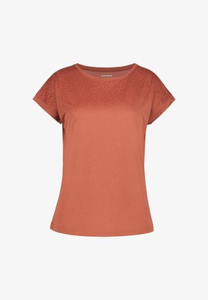 Top de mujer de manga corta color naranja óxido con escote redondo y un sutil estampado floral en la parte superior del pecho y las mangas.