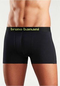 Μαύρα boxer briefs από λεία ύφανση με αντίθετη φαρδιά ζώνη μέσης σε φωτεινό πράσινο, με την επωνυμία "bruno banani." Απλός σχεδιασμός.