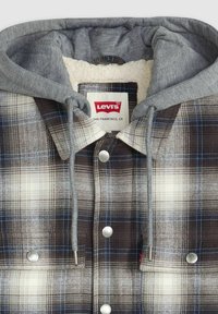 Giacca a camicia a quadri con cappuccio grigio; texture in flanella con controlli marroni, bianchi e blu; accessori in argento; interno foderato in pile.