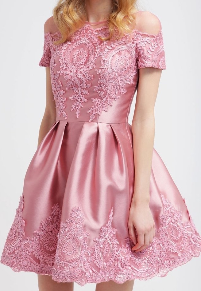 Pink satin dress with off-the-shoulder sleeves, featuring intricate lace embroidery and a flared skirt with decorative hem details.