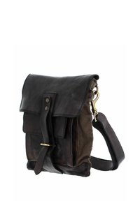 Brown leather bag with a flap cover, featuring a front strap closure, brass hardware, and a crossbody strap for carrying.