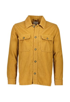 Mustaari keltainen farkkupaita, jossa on kaulus, nappikiinnitys, kaksi rintataskua ja ribbauskoostumus. Napit ovat tummat.