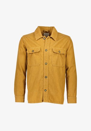 Corduroy skjorte i sennepsgul, med krave, knaplukning, to brystlommer og ribbet tekstur. Knappene er mørke.
