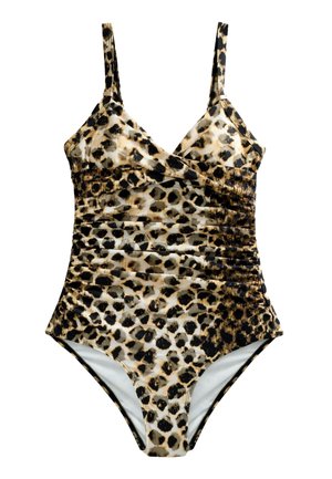 Zbliżenie górnej części tułowia kobiety ubranej w strój kąpielowy w panterkę z cienkimi regulowanymi ramiączkami, oświetlony światłem słonecznym.