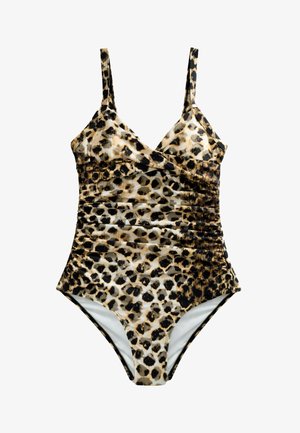 Prim-plan cu partea superioară a trunchiului unei femei care poartă un costum de baie cu imprimeu leopard și bretele subțiri reglabile, sub lumina soarelui.