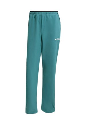 Pantaloni sportivi color turchese con cintura elastica, gambe affusolate e un piccolo logo bianco sulla coscia sinistra. Realizzati in tessuto leggero e liscio.
