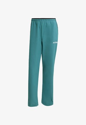 Teal sportbroek met een elastische tailleband, tapse benen en een klein wit logo op de linker dij. Gemaakt van gladde, lichte stof.