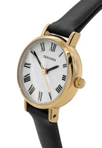 Montre-bracelet dorée avec un cadran circulaire blanc, des chiffres romains et des aiguilles noires. Dotée d'un bracelet en cuir noir et d'un cadran texturé.