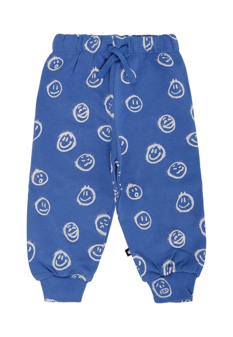 Blauwe katoenen sweatpants met een elastische tailleband, voorzien van een willekeurig patroon van witte glimlachende gezichtjes. Inclusief manchetboorden en een trekkoorddetail.