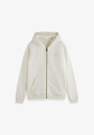 Cream zip-up hoodie with a hood, long sleeves, front pockets, and drawstring. Smooth texture and minimalistic design.