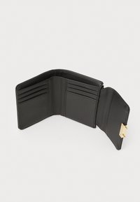 Black leather wallet with multiple card slots and zippered compartment, featuring a gold-tone hardware accent on the closure.