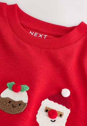 Red sweater featuring a rounded collar, with embroidered designs of Santa and a Christmas pudding, textured accents in white and green.
