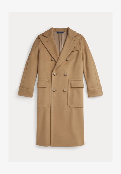 Kamelivärvi kahe nööbiga särk, villasegu kangas, lõikega krae, kaks eesmist taskut, nööbikaunistused ja mansetid.