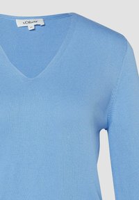 Light blue long-sleeve V-neck knit sweater with a small white size and brand label inside the collar reading s.Oliver, size 36.