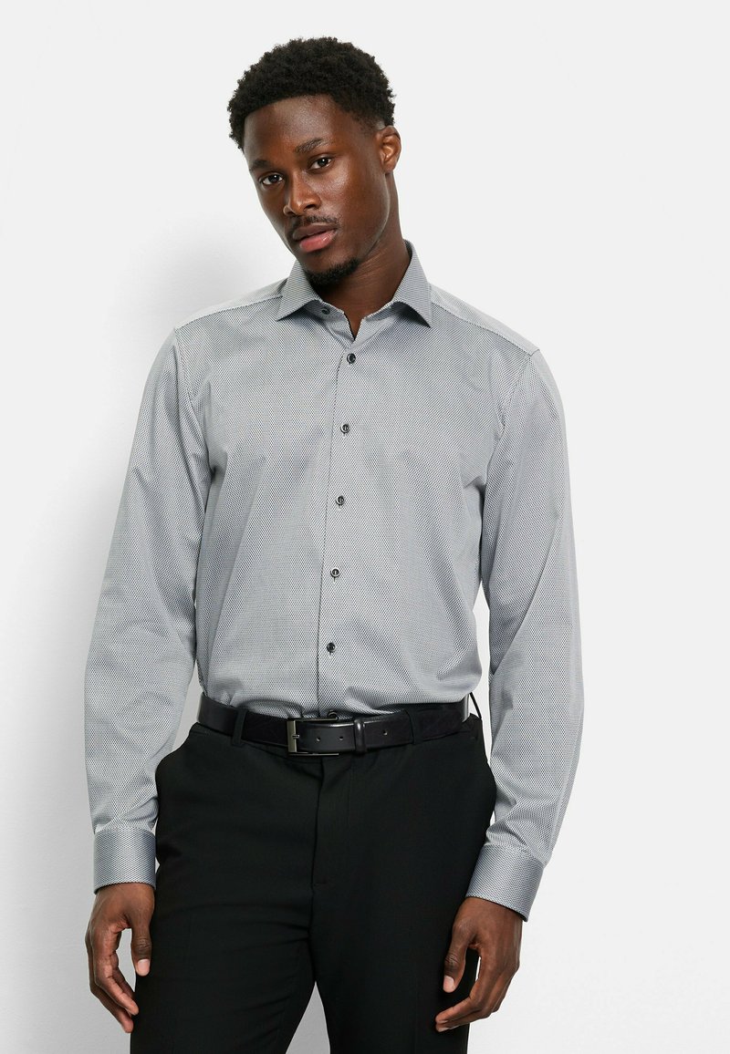 Gray patterned button-up shirt with a classic collar, long sleeves, and black buttons, paired with black trousers and a black belt.
