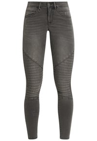 Vaqueros de mezclilla gris oscuro de corte ajustado con paneles acanalados en las rodillas, bolsillos delanteros, trabillas para cinturón y cierre de botón.