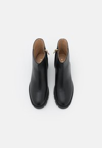 COACH Botines con plataforma - black