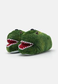 Grønne dinosaur-tema tøfler med teksturert grønn stoff, røde og hvite tennene, store svarte øyne og en fluffy utseende.