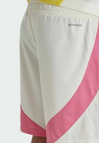 White athletic shorts featuring a pink mesh panel along the side, elastic waistband, and "AEROREADY" branding on the back.