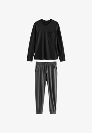 Chemise noire à manches longues avec une poche poitrine, assortie à un pantalon gris à cordon de serrage avec des poignets élastiques et des poches latérales. Tissu doux.