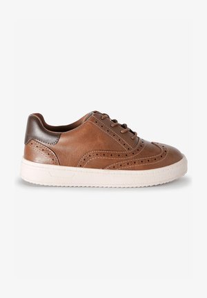 Brown leather sneaker with perforated design, contrasting dark brown heel, and white rubber sole. Laced closure and textured upper.