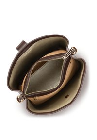 Brown leather handbag with a light beige interior, featuring a zippered pocket and gold hardware. Soft texture and rounded shape.