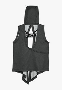 Harmaa hihaton huppari, jossa syvä V-mallinen selkäosa, ristikkäiset olkaimet ja Nike-logo nauhassa. Valmistettu pehmeästä, hengittävästä kankaasta.