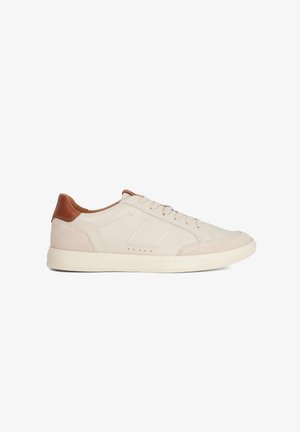 Low-top sneakers made of beige leather with brown leather accents, featuring a smooth texture, round toe, and minimalistic design.