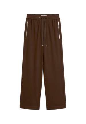 Braune weite Hose mit elastischem Bund, Kordelzug und Reißverschlusstaschen auf beiden Seiten, dargestellt vor weißem Hintergrund.
