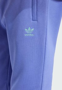 adidas Originals ESS PT - Tracksuit bottoms - semi blue