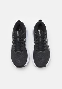 Black athletic shoes with a textured, breathable upper, white accents, and textured sole. Features traditional lacing and padded opening.