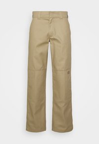 Pantalones de pierna ancha color caqui, confeccionados con tejido duradero, con una textura suave, corte recto y parches en las rodillas. Incluye un pequeño parche con el logo.