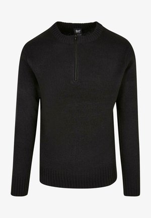 Černý pletený svetr s vysokým výstřihem a čtvrtinovým zipem. Obsahuje žebrované manžety a lem, které zdůrazňují strukturovanou tkaninu.