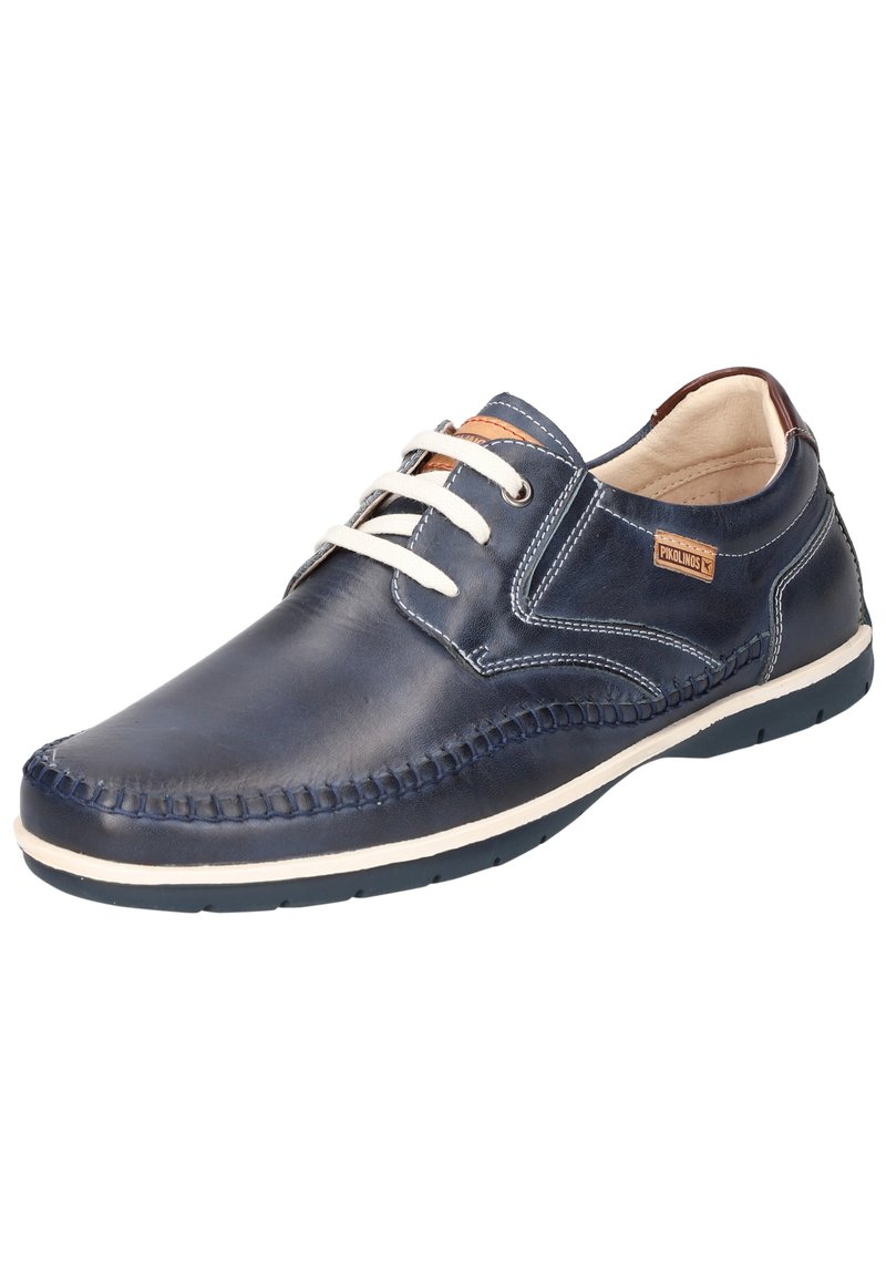 Scarpa di pelle blu con lacci bianchi, dettagli cuciti e una finitura liscia. Presenta un accento color cuoio e una suola in gomma flessibile.
