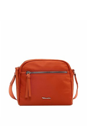 Orange crossbody bag with front zipper pocket, long strap, and small silver Tamaris logo on the lower front, against white background.