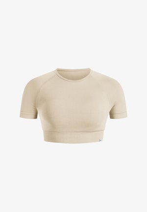 Beżowy, krótkotrwały top sportowy z okrągłym dekoltem i krótkimi rękawami raglanowymi. Gładki materiał z ribbowanym wykończeniem i minimalnym logo.