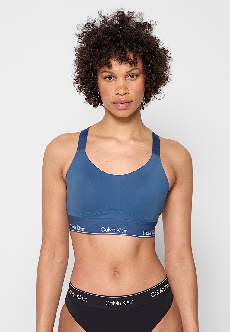 Calvin Klein - Sujetadores deportivos con sujeción alta (azul)