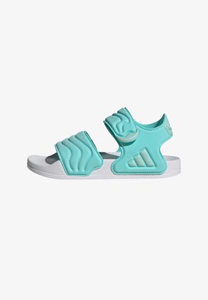 Turkise sandaler med tekstureret overdel, to justerbare remme og en hvid sål. Indeholder Adidas-logo på siden. Fremstillet af syntetisk materiale.