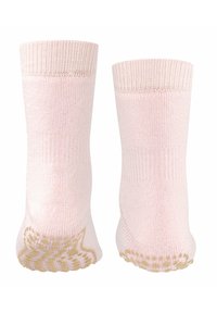 Calze in cotone rosa con bordi a costine e un motivo in grip oro testurizzato sulle suole, caratterizzate da una finitura liscia e di altezza media.