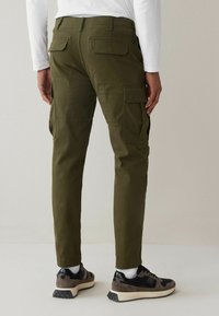 Next SLIM FIT STRETCH - Cargohose - green