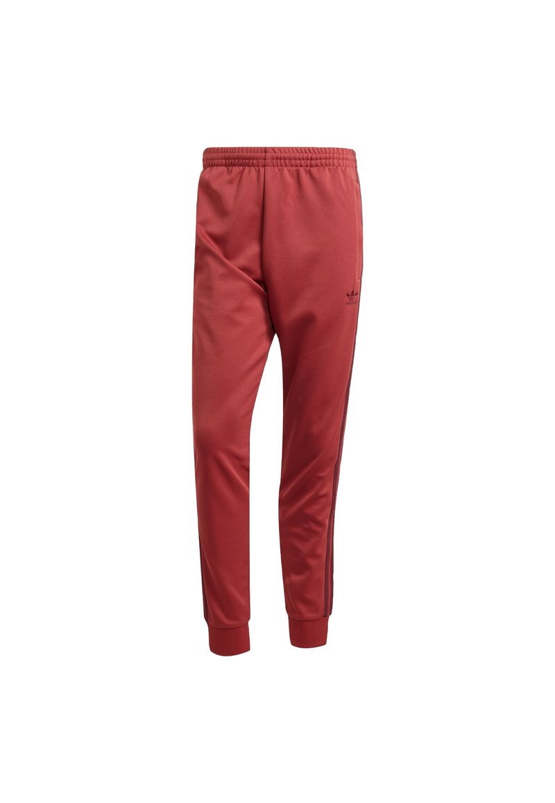 Red athletic pants with an elastic waistband, tapered ankle cuffs, and black side stripes. Features a small black logo on the thigh.