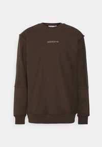 Brun långärmad sweatshirt i mjukt material, med rundad halsringning, ribbade ärmslut och en liten Adidas-logga broderad på framsidan.