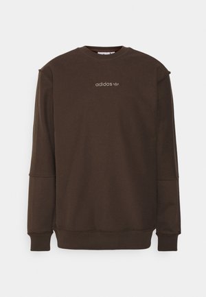 Sweatshirt marron à manches longues en tissu doux, avec un col rond, des poignets côtelés et un petit logo Adidas brodé sur le devant.