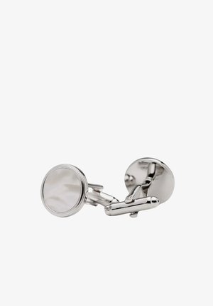 Silver cufflinks med runda, släta ytor och en polerad yta. Har en klassisk design och ett rörligt lås för enkel användning.