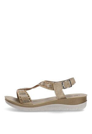 Sandalias beige con correas texturizadas, que presentan acentos brillantes y una suela acolchada de soporte. Hebilla ajustable para un mejor ajuste. Diseño ligero.